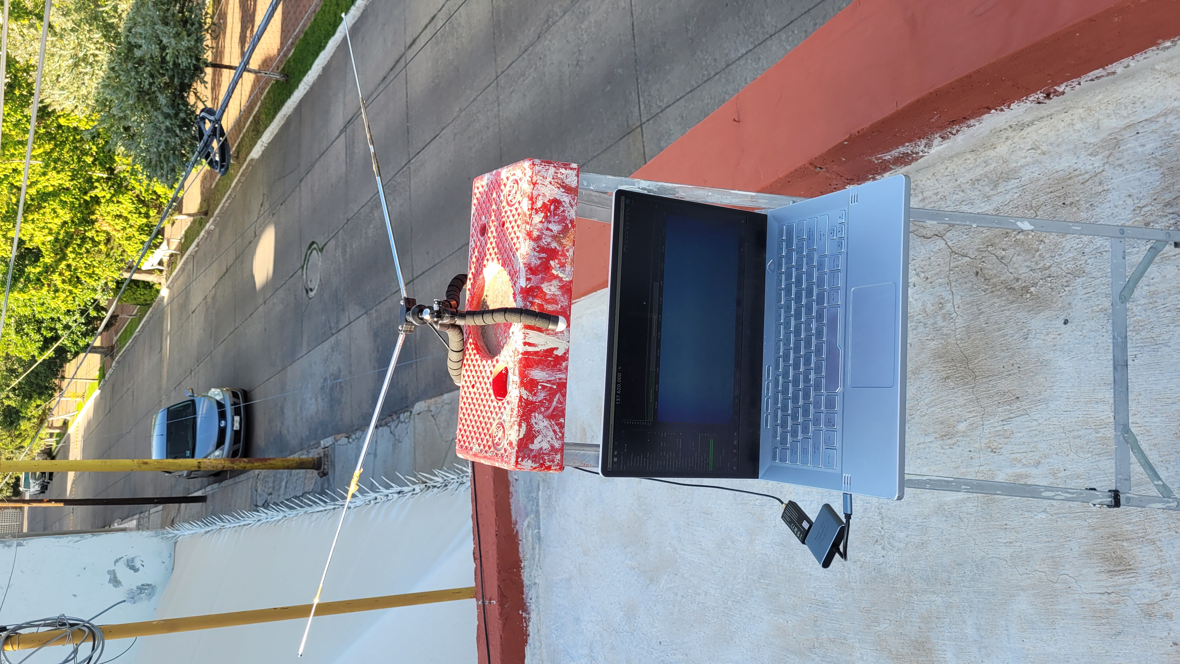 An antenna on top of a laptop outside